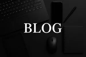 text of blog in the background of laptop,mouse and phone digitalmmarketing consultant in wayanad